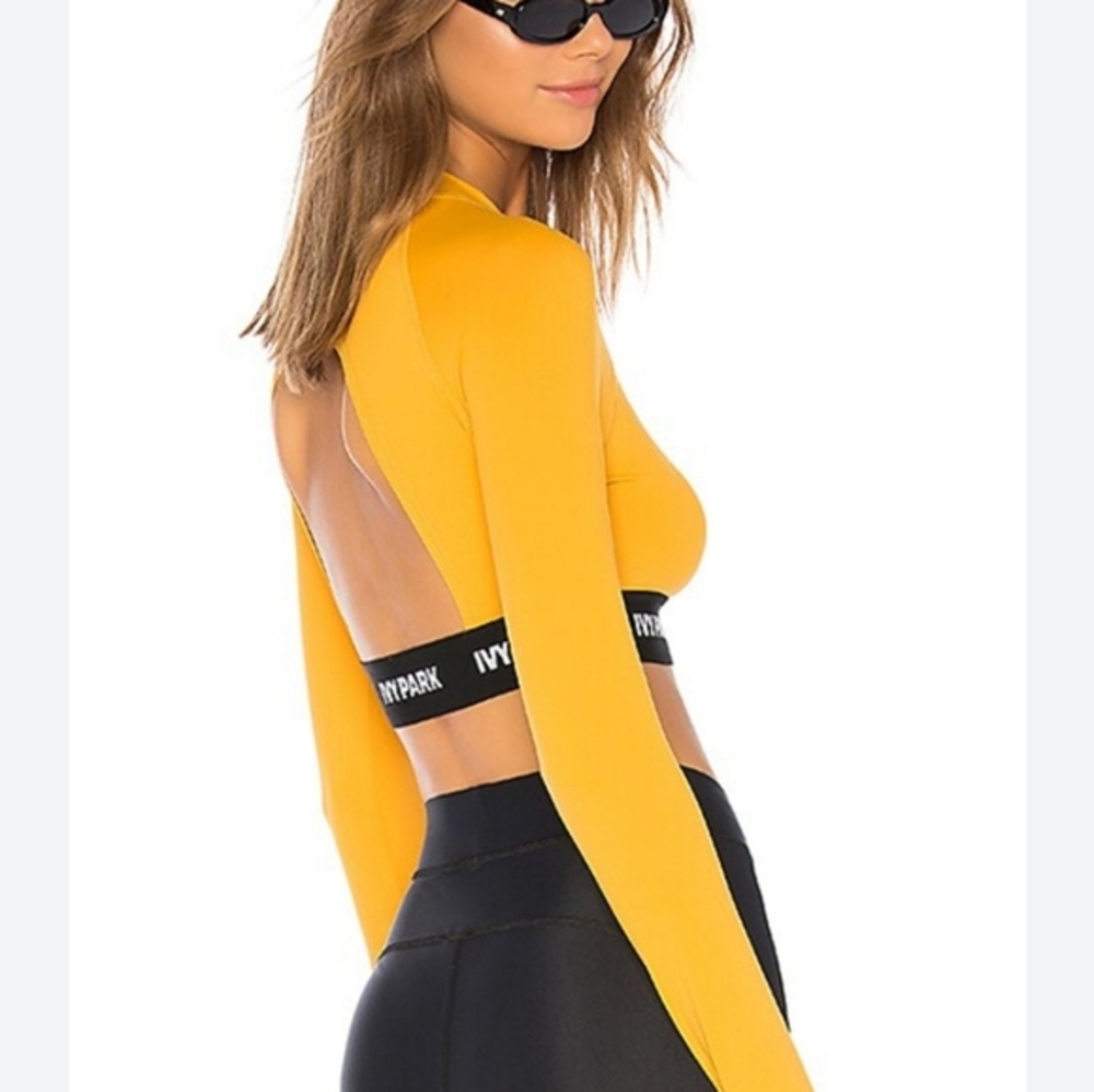 Revolve Ivy Park M Logo Tape Crop Top in‎ Golden Orange